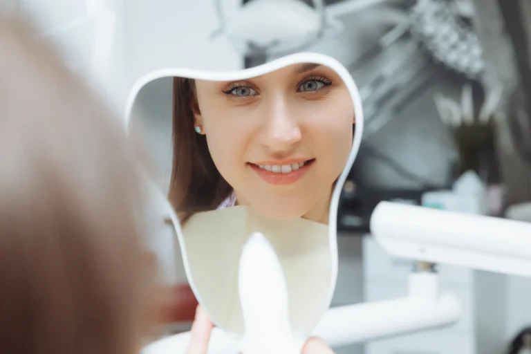 Woman checking teeth appearance