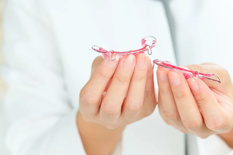 Clear orthodontic retainer hands